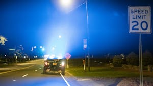 A police car parked on Franklin Street flashes its lights on Saturday, Aug. 29, 2020.