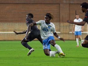 UNC sophomore forward Ernest Bawa (20) goes for the ball during the Sept. 14, 2021, men's soccer game against Campbell University. Carolina walked away with a home-field 1-0 win.