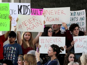 Protesters attend a rally at the Federal Courthouse in Fort Lauderdale, Florida, to demand government action on firearms, on Feb. 17, 2018. Their call to action is a response the massacre at Marjory Stoneman Douglas High School in Parkland, Florida. (Mike Stocker/Sun Sentinel/TNS)