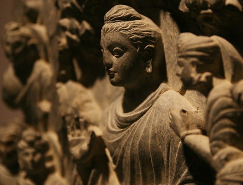 Many different media make up the exhibit, including this stone carving of Buddha.  DTH/Andrew Johnson