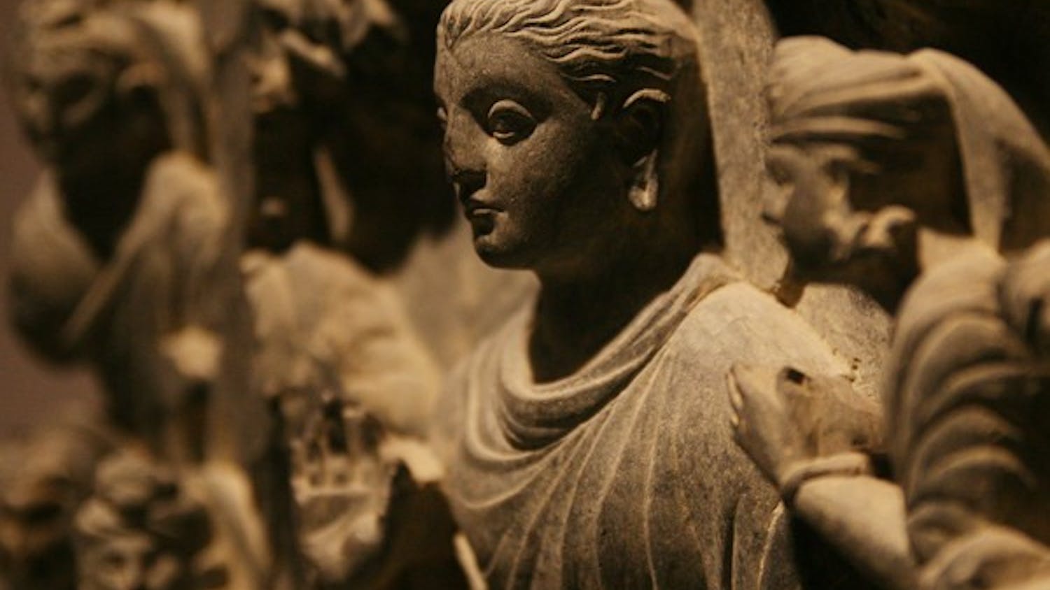 Many different media make up the exhibit, including this stone carving of Buddha.  DTH/Andrew Johnson