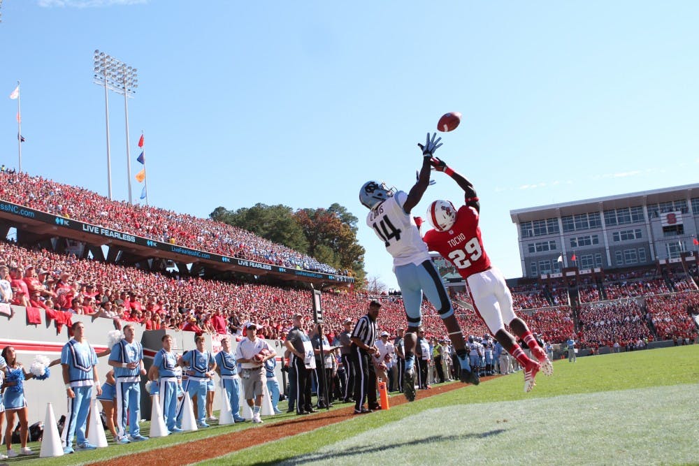 	Wide Receiver Quinshad Davis (14) catches UNC&#8217;s first touchdown of the game against N.C. State.