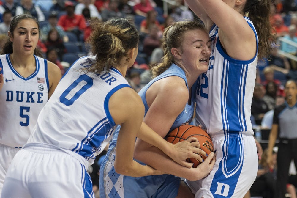 <p>UNC junior guard Alyssa Ustby (1) tries to maintain possession of the ball during the women’s basketball game in the third round of the ACC tournament in Greensboro, N.C., on Friday, March 3, 2023. UNC fell to Duke 40-44.</p>