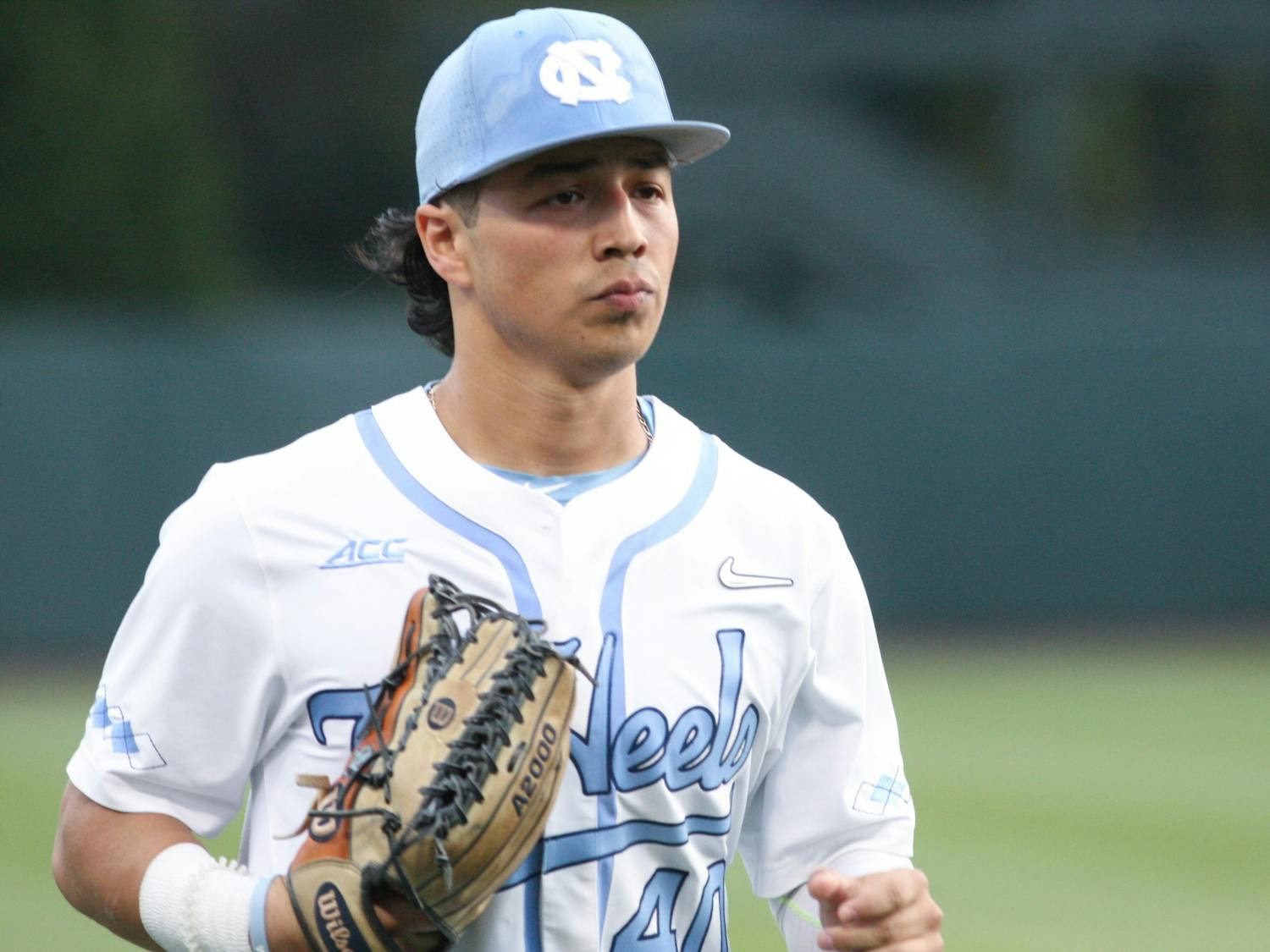 UNC junior outfielder Angel Zarate (40) returns to the dugout during a home game at Boshamer Stadium against Appalachian State on Tuesday, March 22, 2022.