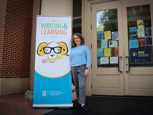 Kim Abels, director of the UNC Writing and Learning Center, poses outside of the Student and Academic Services Building on June 8, 2021.