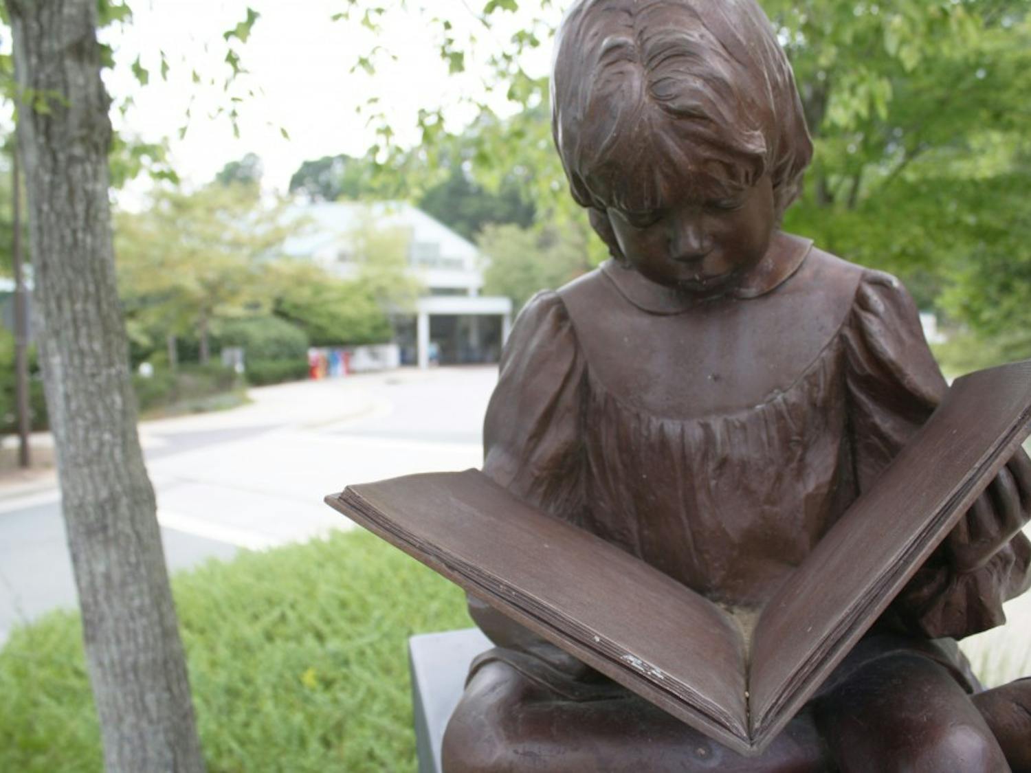 Once Upon a Time, sculpted by Betty Branch and commissioned by Roanoke City Library Foundation, outside the Chapel Hill Public Library.