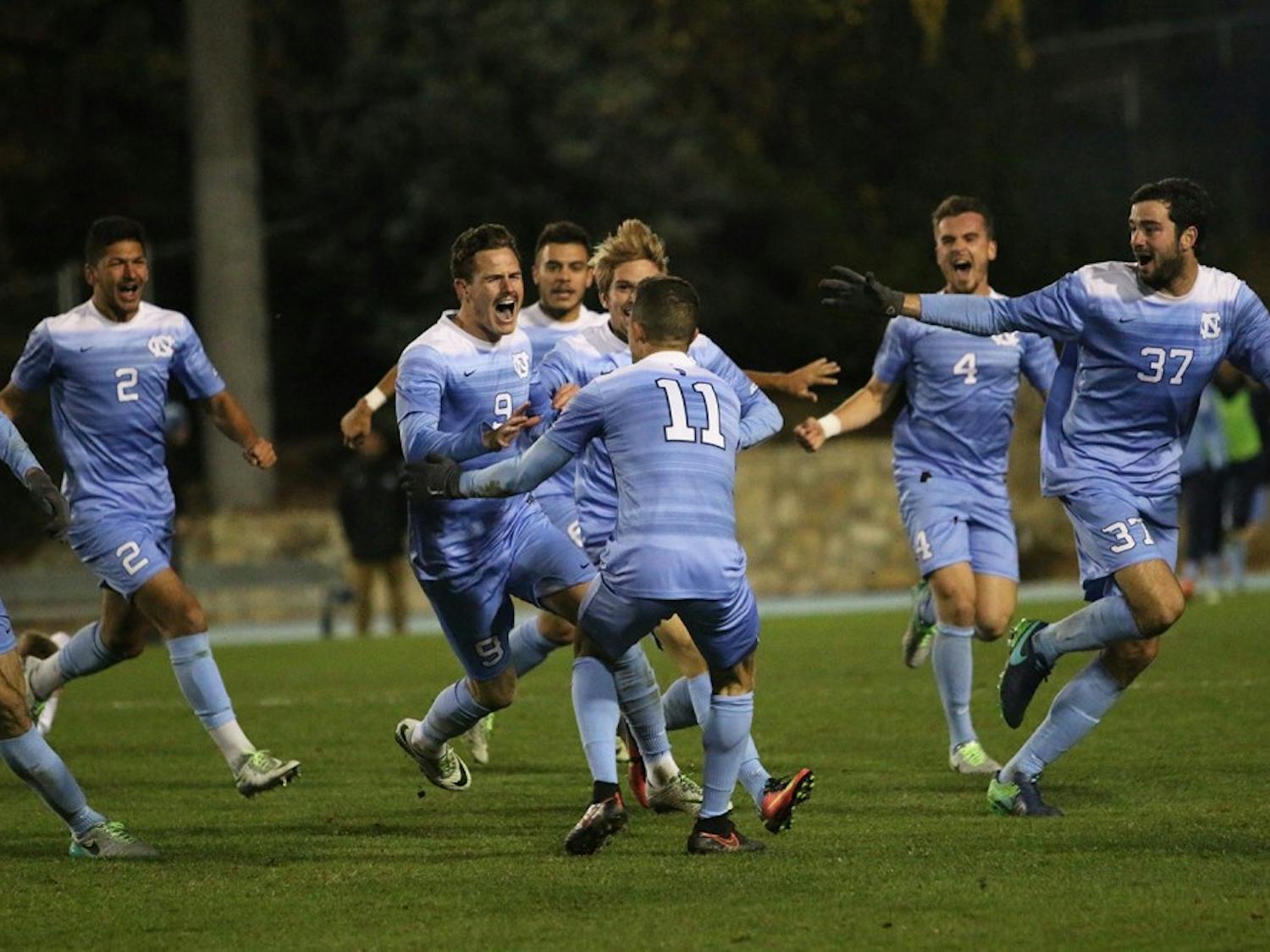 The North Carolina men's soccer team celebrates an overtime win over Providence in the 2016 NCAA Elite Eight.