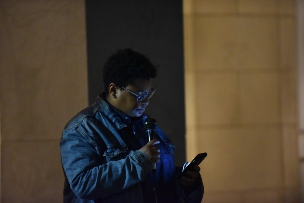 <p>Maya Little reads her court statement across the street from where Silent Sam stood on Monday Oct. 15, after her court proceedings earlier in the day.</p>
