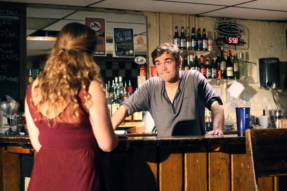 Camille Oswald (left) plays W and Sam Fletcher (right) plays John in Lab! Theatre's production of Cock. 