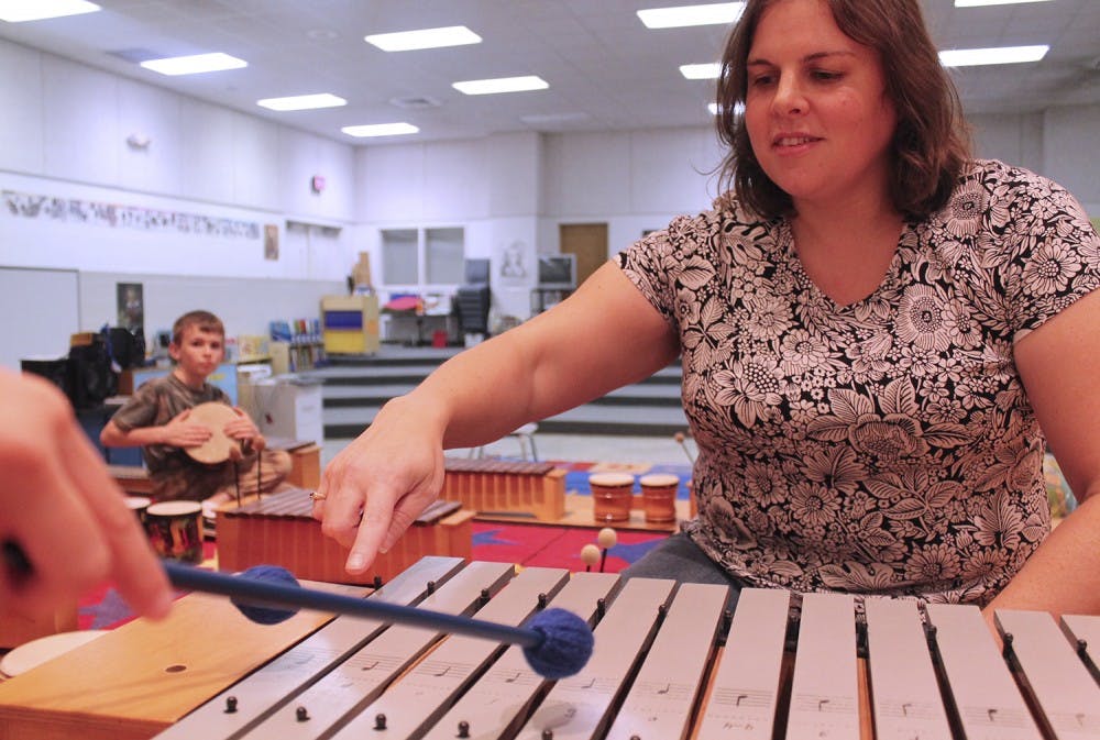 Sarah Davies, a music teacher at New Hope Elementary School, teaches with materials purchased through Donorschoose.org.