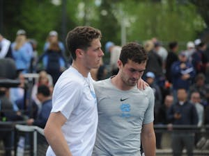 Senior Blaine Boyden comforts junior William Blumberg after his singles loss at the ACC tournament semifinals. UNC played against Virginia and lost 3-4. Blumberg won his doubles match with senior Blaine Boyden and lost his singles match.