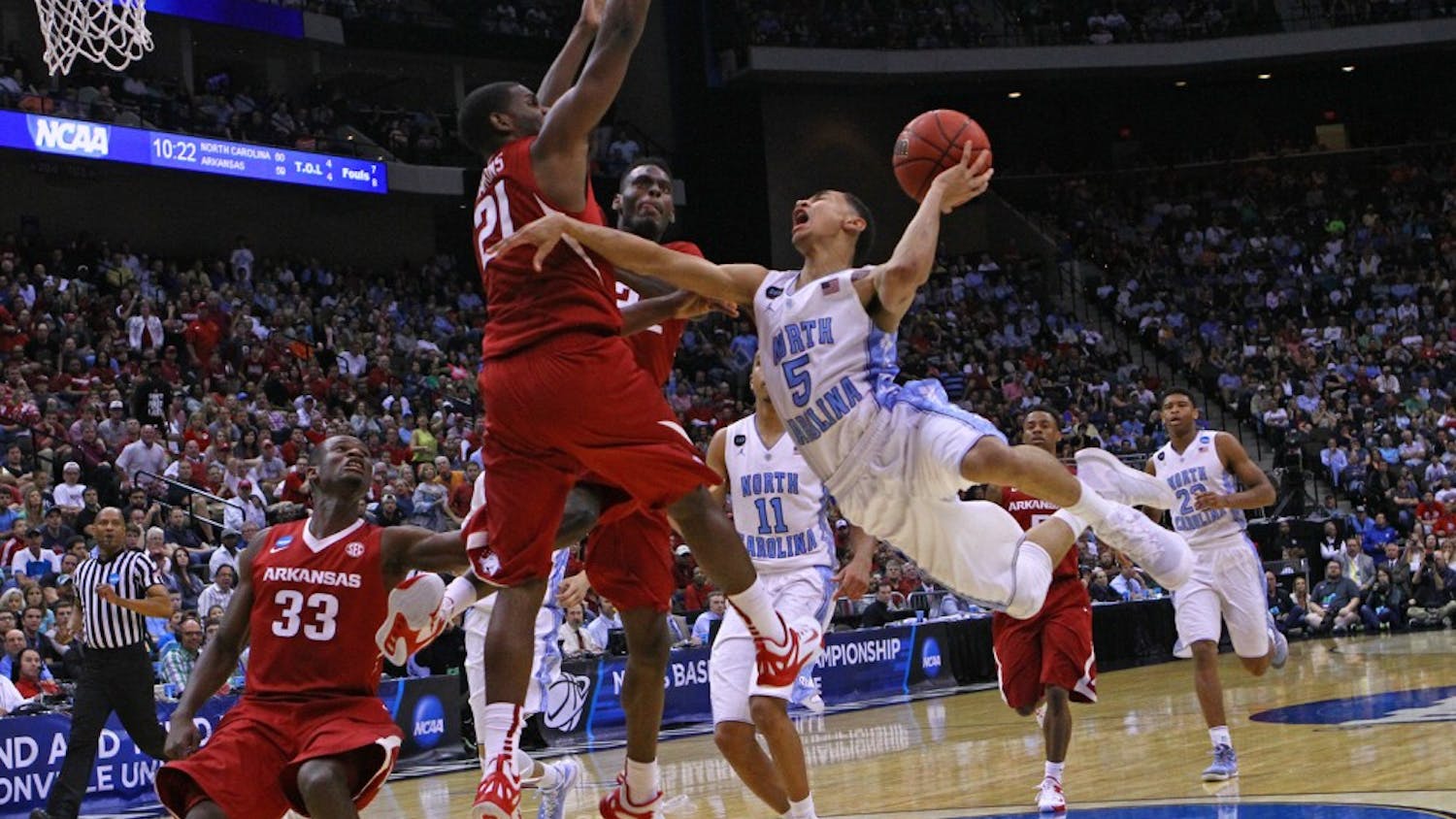UNC guard Marcus Paige (5) goes up for a layup.  The Tar Heels defeated the Arkansas Razorbacks, 87-78, on Saturday in Jacksonville, Fla.