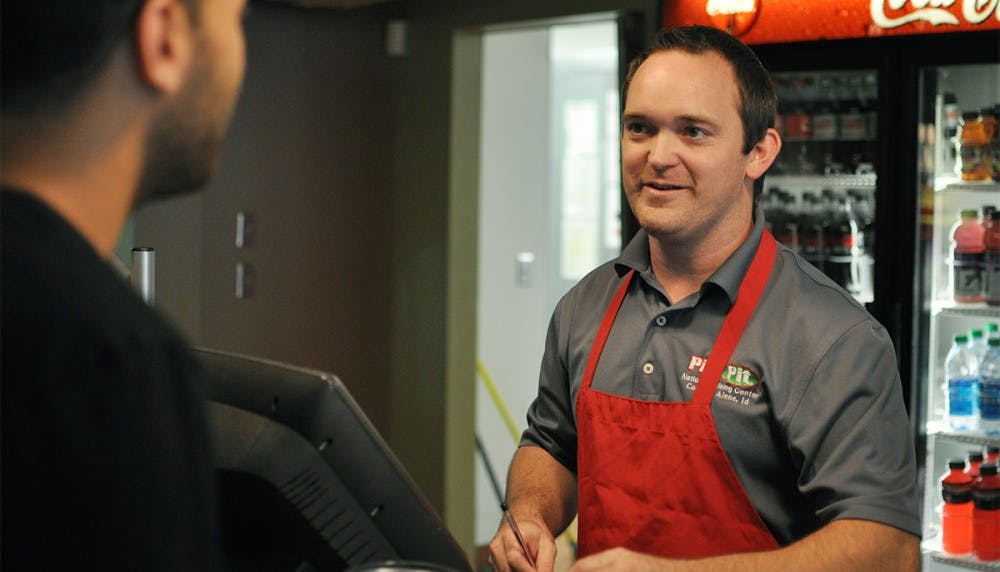 Josh Sanders, owner of Pita Pit on Franklin Street, is coming up on one year of ownership of the restaurant. This month marks its tenth year on Franklin Street. Enthusiastic about his restaurant, his customers, and his involvement with the community, Sanders says, "I always thought of the food business as more of a people business anyway." Many of his customers are long-time regulars whose names and orders he remembers.
(Zach Hunter, on left, spring 2012 graduate from UNC, still lives in CH)