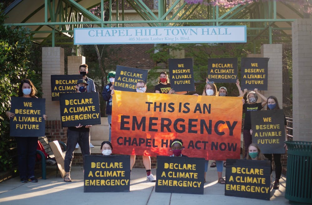 Sunrise Movement gathers outside of the Chapel Hill town hall on April 5, 2021 to demand that the town declare a climate emergency. Photo courtesy of Dana Gentry.