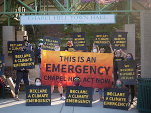 Sunrise Movement gathers outside of the Chapel Hill town hall on April 5, 2021 to demand that the town declare a climate emergency. Photo courtesy of Dana Gentry.
