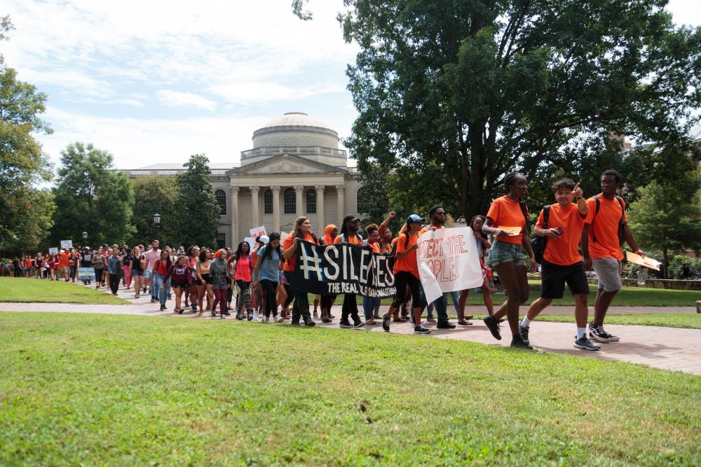 <p>After rallying against the shut down of the UNC Center for Civil Rights, protesters march to Silent Sam to show solidarity with the sit-in.</p>