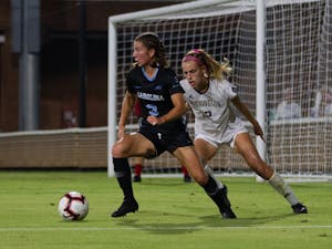 UNC first-year midfielder Ruby Grant (3) passes the ball during the matchup against Washington on Thursday, Aug. 19, 2021 at Dorrance Field.