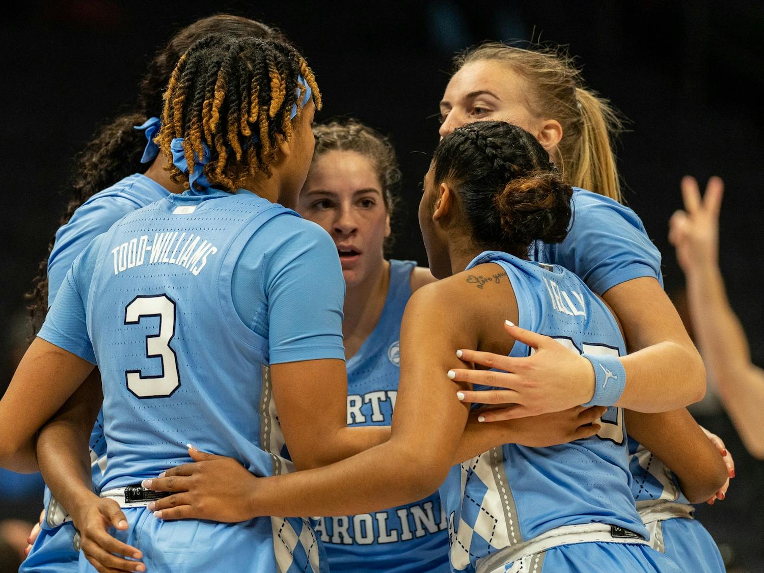The team huddles up before a free throw during the women’s basketball game against Michigan at the Jumpman Invitational on Tuesday, Dec. 20, 2022, at the Spectrum Center. UNC fell to Michigan 76-68.