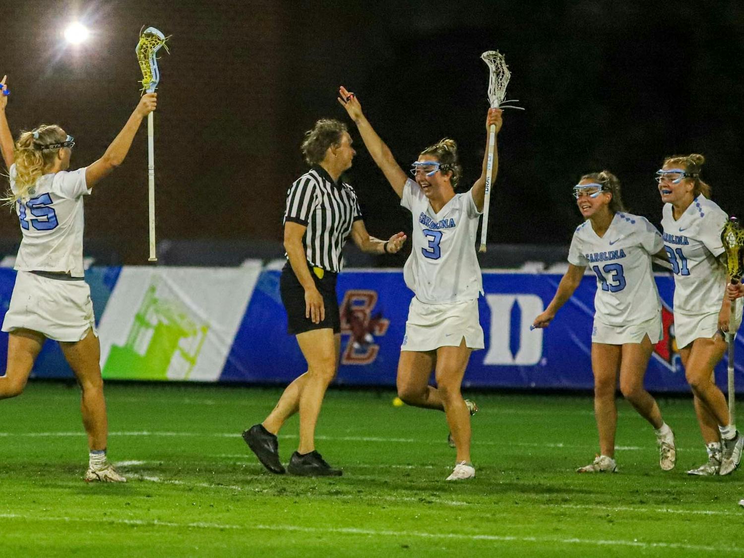 Fifth year attacker Jamie Ortega (3) celebrates a goal with teammates during the 2022 ACC championship game against Boston College on May 7, 2022, in Chapel Hill, NC. UNC won the title 16-9.