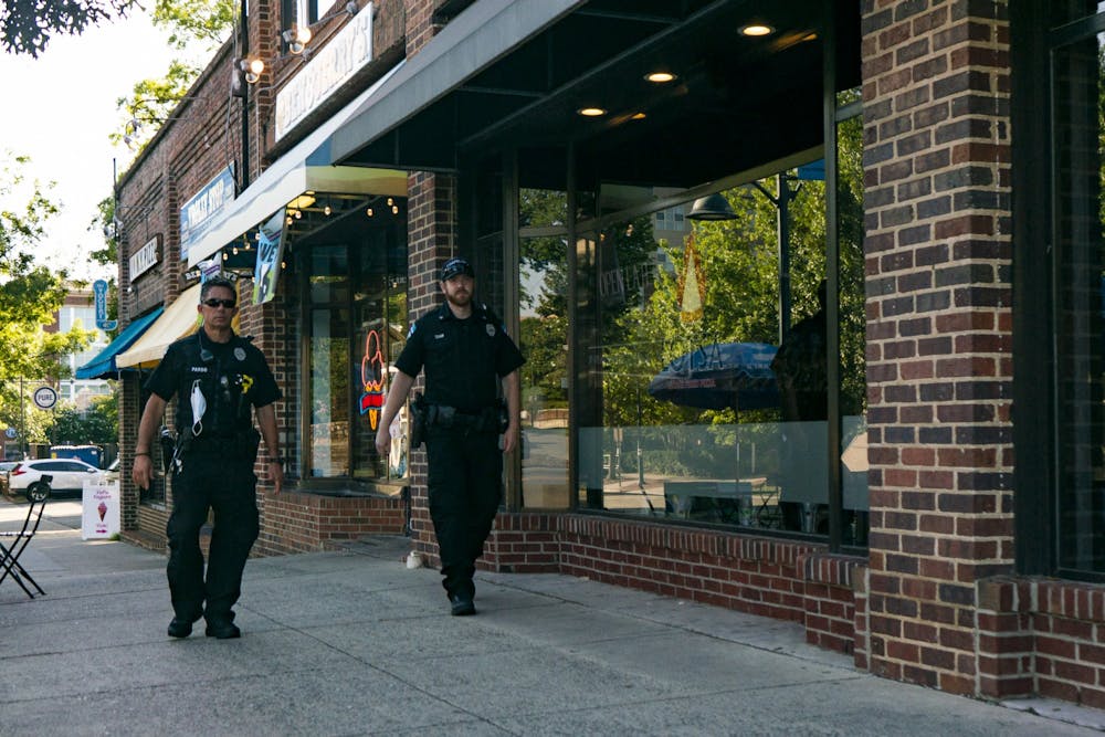 Two Chapel Hill police officers walk east on Franklin Street on Sunday, June 7, 2020.