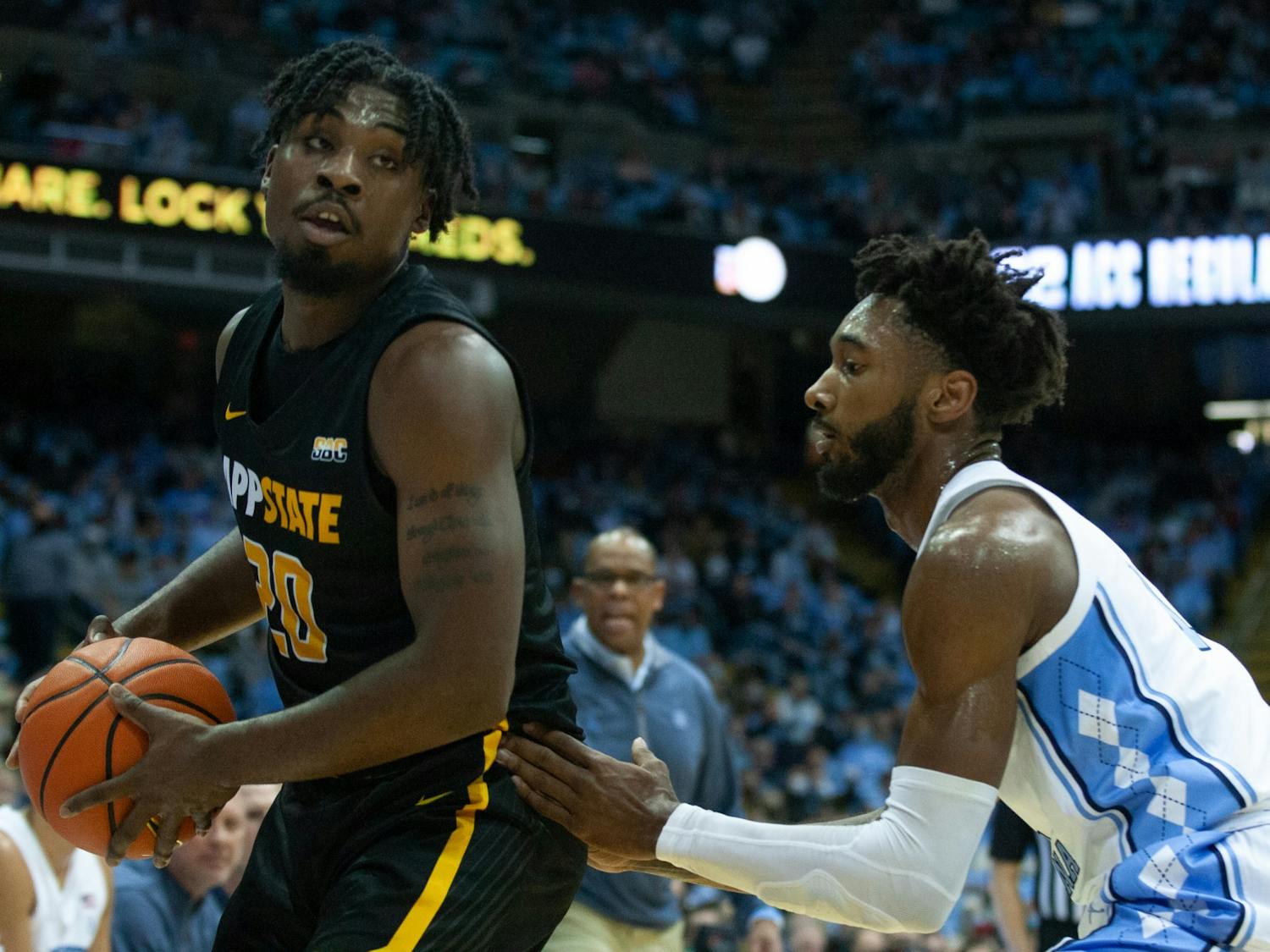 Senior forward Leaky Black (1) guards an Appalachian State player at the game on Dec 21, 2021 at the Dean E. Smith Center. UNC won 70-50.