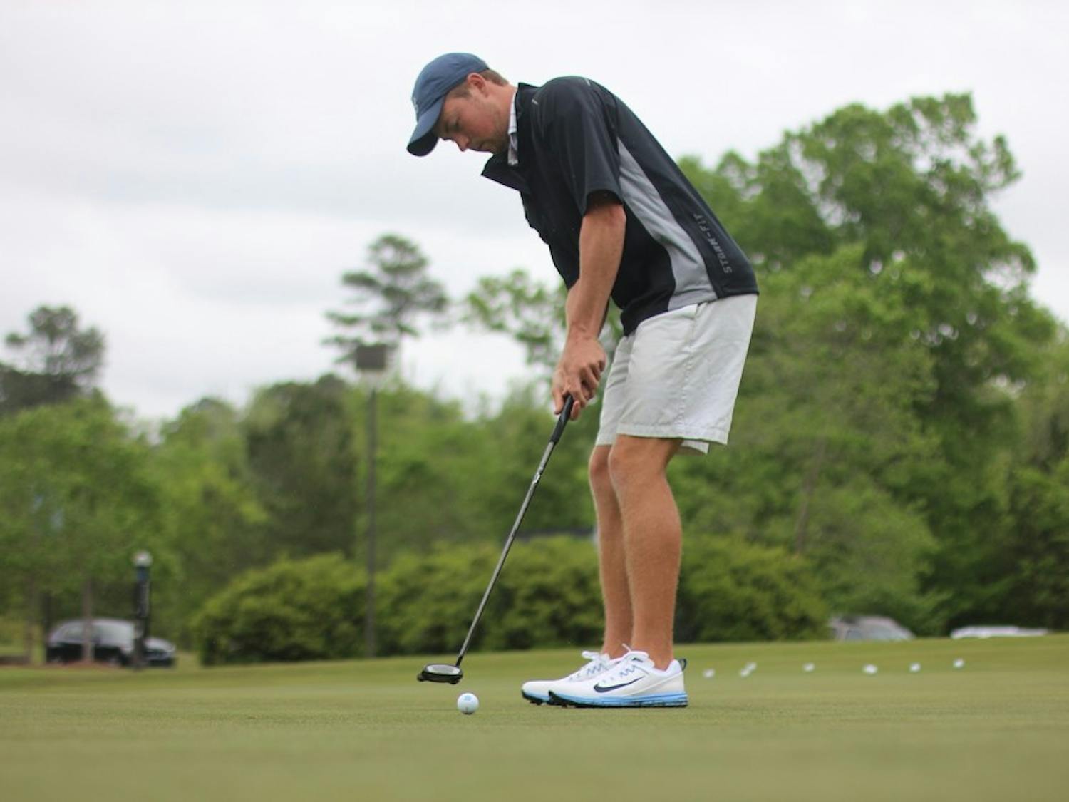 North Carolina's Ben Griffin takes a practice putt in the 2017 ACC Championships.