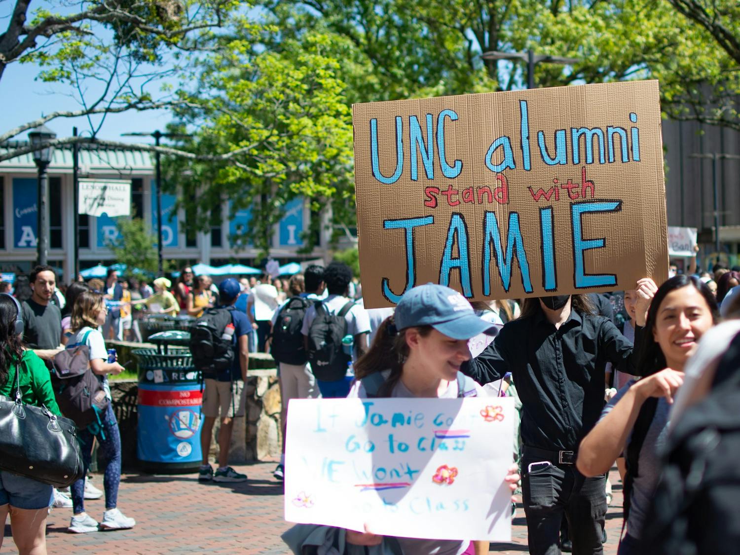 UNC Law Students walk through the Pit on Thursday, April 13, 2023. The students walked out in support of Jamie Marsicano, a student removed from the program after her arrest in Georgia.