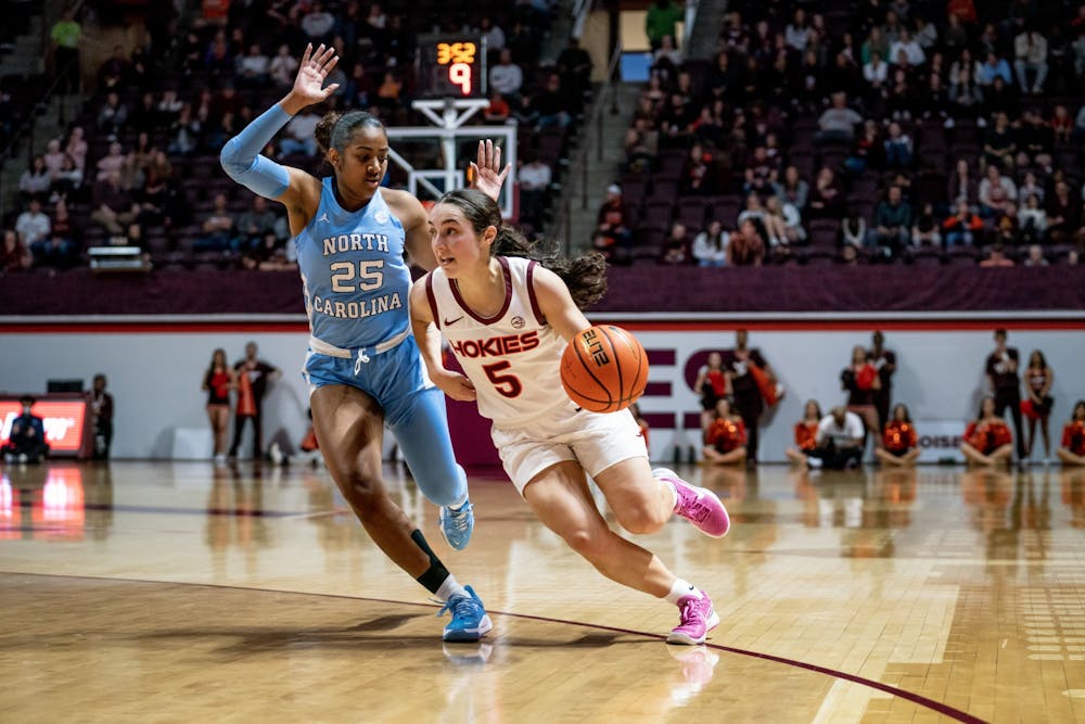 Virginia Tech junior guard, Georgia Amoore (5) drives to the basket while guarded by UNC junior guard, Deja Kelly (25) on Jan. 1 2023 in Cassel Coliseum. Photo Courtesy of Virginia Tech Athletics. 