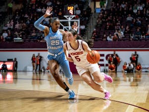 Virginia Tech junior guard, Georgia Amoore (5) drives to the basket while guarded by UNC junior guard, Deja Kelly (25) on Jan. 1 2023 in Cassel Coliseum. Photo Courtesy of Virginia Tech Athletics. 