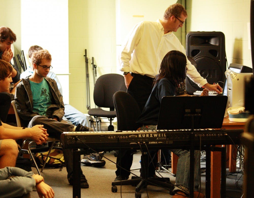 Stephen Anderson, assistant professor in the Department of Music, and junior music major Ndidi Morton workshop her piece in the Electro-Acoustic Studio during an advanced music composition course Tuesday.