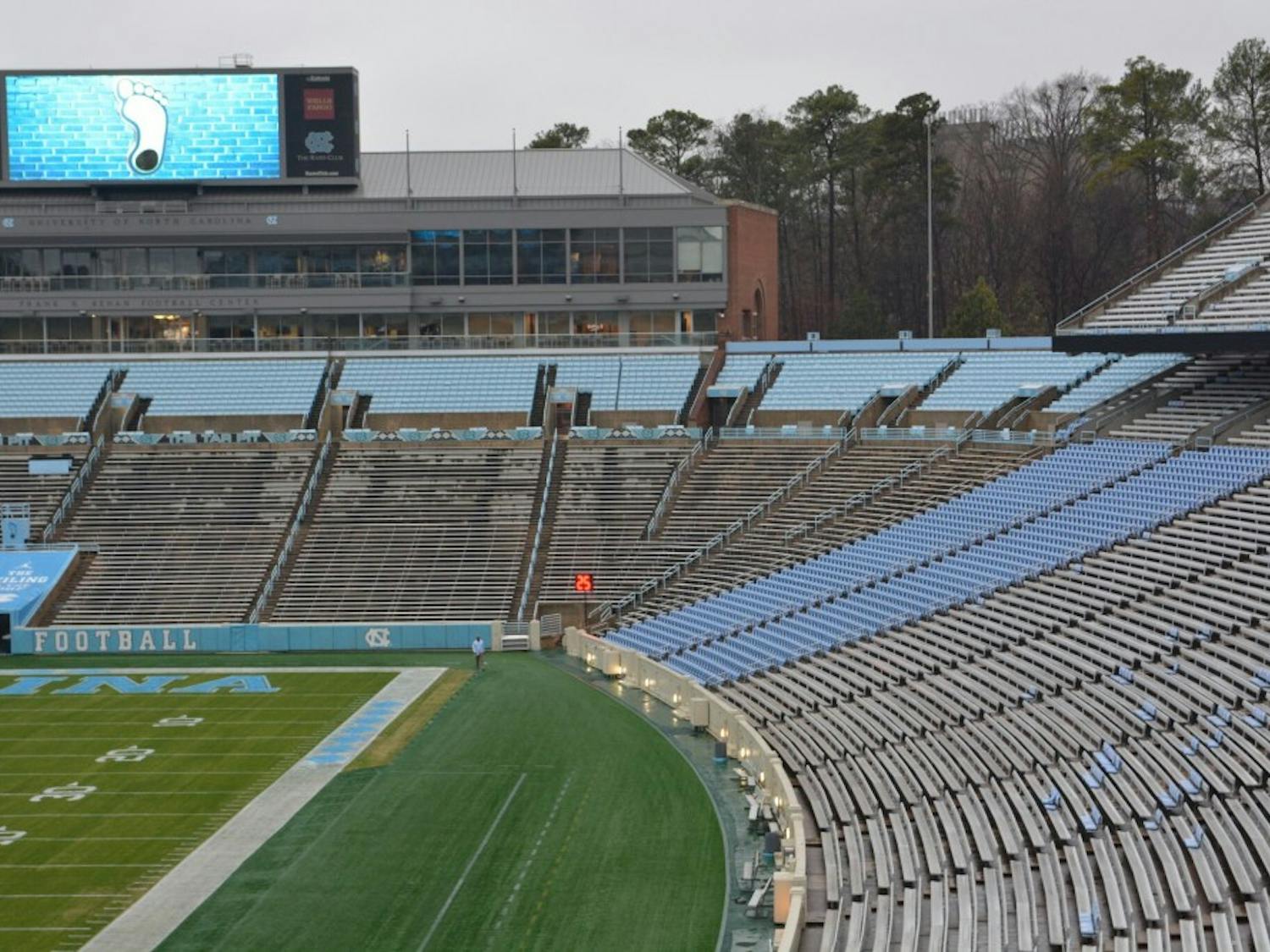 After experimenting with individual seating in sections 110 and 111 (in blue on the right side), UNC is renovating Kenan Stadium and adding individual seats throughout.