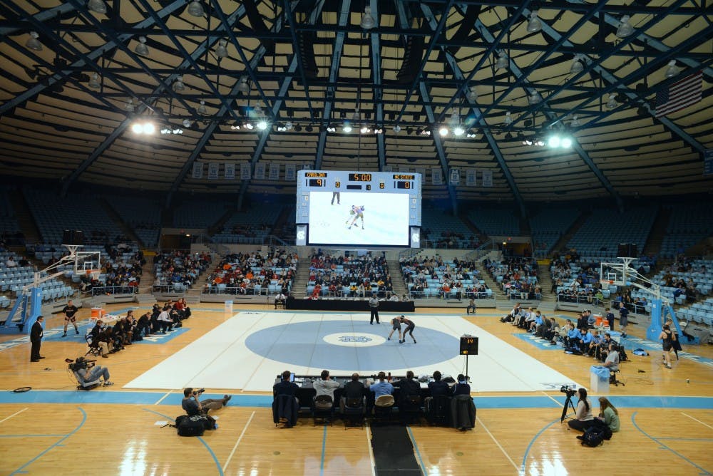 The UNC wrestling team competes in a match against N.C. State in Carmichael Arena on Feb. 1, 2023.&nbsp;