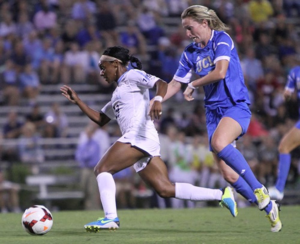 	Crystal Dunn, 19, drives ahead a UCLA player in the match up between #1 UNC and #2 UCLA in Friday night&#8217;s game in Durham. 