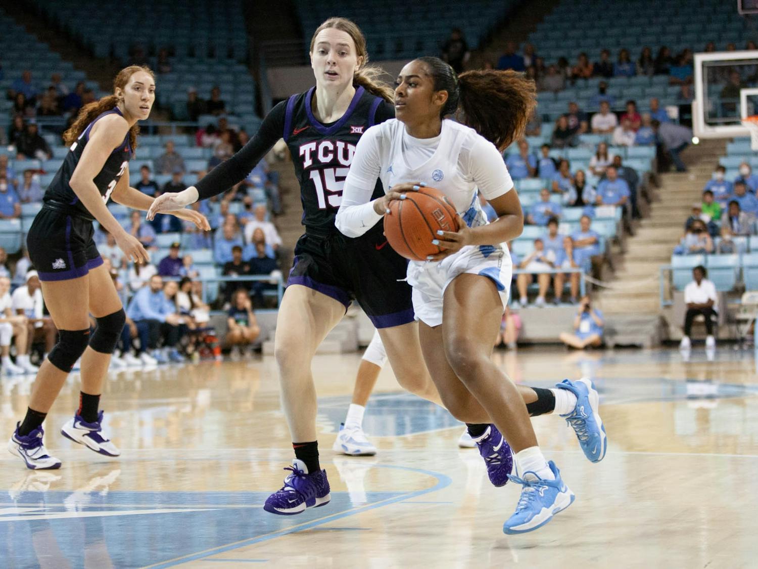 UNC junior guard Deja Kelly (25) dribbles the ball during the women's basketball game against TCU on Saturday, Nov. 11, 2022, at Carmicheal Arena. UNC beat TCU 75-48.
