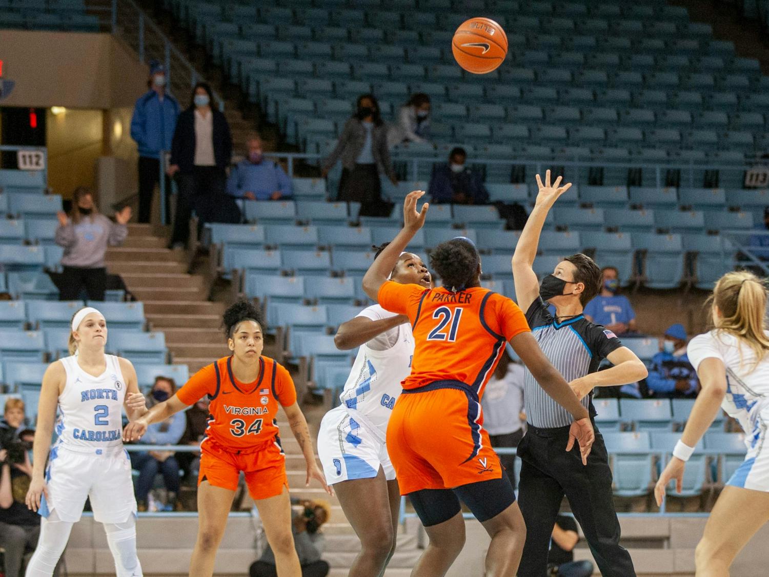 UNC and Virginia attempt to gain possession from the tip-off against UVA at Carmichael Arena on Jan. 20 2022. The Tar Heels beat the Cavaliers 61-52.