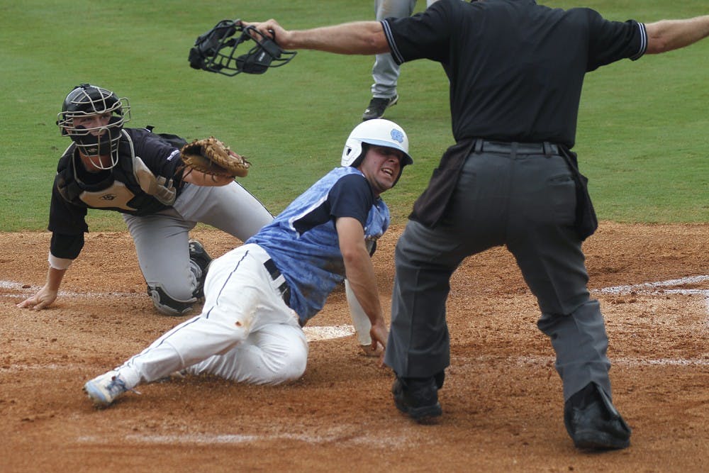 Sophomore Alex Raburn is called safe at home plate during UNC’s 12-5 loss to Long Beach State in the Gainesville, Fl regional of the NCAA tournament.