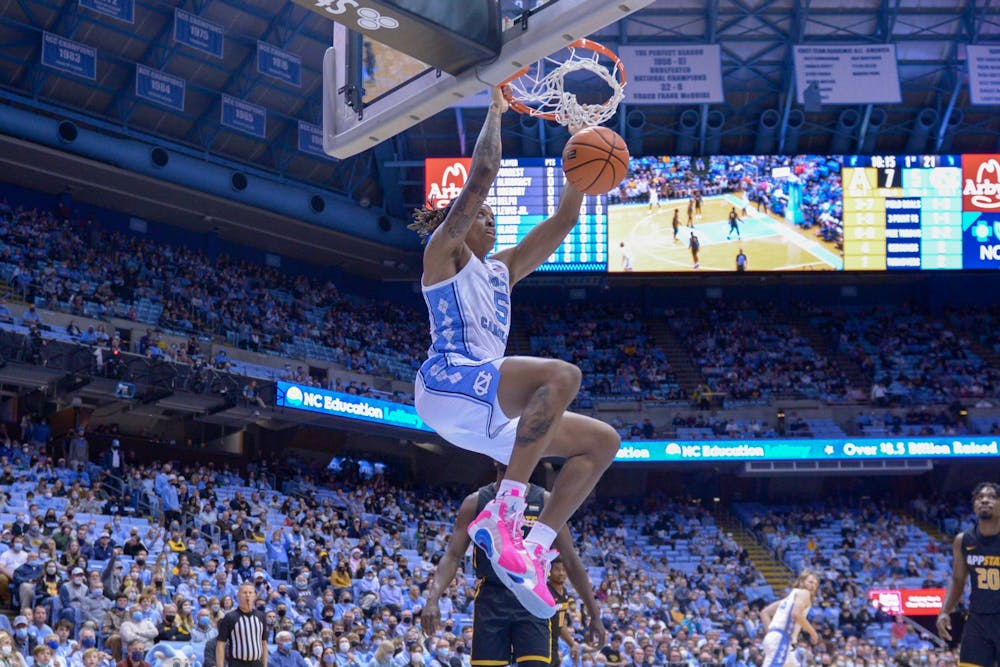 Junior forward/center Armando Bacot (5) scores a point against App State in the Dean E. Smith Center on Dec 21, 2021.