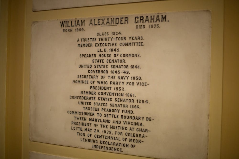A plaque to honor William Alexander Graham, Confederate States Senator among many other titles, is pictured on display in Memorial Hall on Thursday, Jan. 16, 2020. After the UNC System's decision to give funding and perpetual rights to Silent Sam to the North Carolina Sons of Confederate Veterans, Carolina Performing Arts released a statement on how surprised they were about the decision. Though CPA's statement recognized the plaques as a reminder of Southern history, their future is unknown.