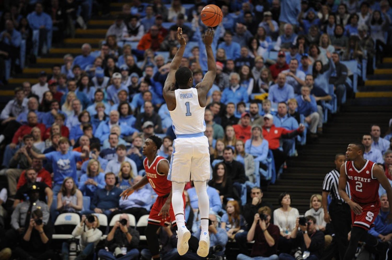 Junior&nbsp;Theo Pinson (1) pulls up for a three point shot.&nbsp;Pinson played his first game of the season against N.C. State on Sunday after injuring his food.&nbsp;