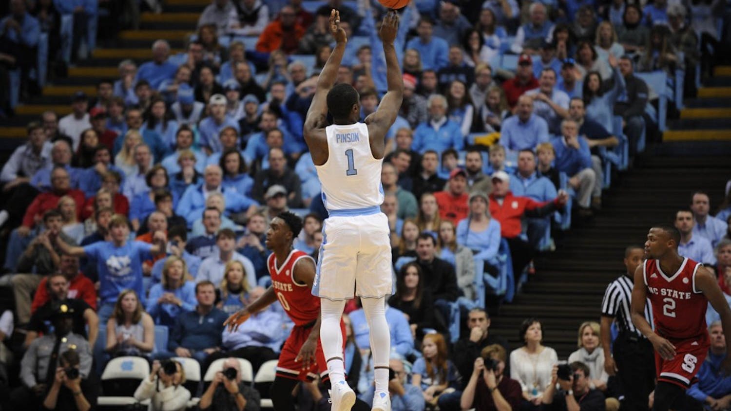Junior&nbsp;Theo Pinson (1) pulls up for a three point shot.&nbsp;Pinson played his first game of the season against N.C. State on Sunday after injuring his food.&nbsp;