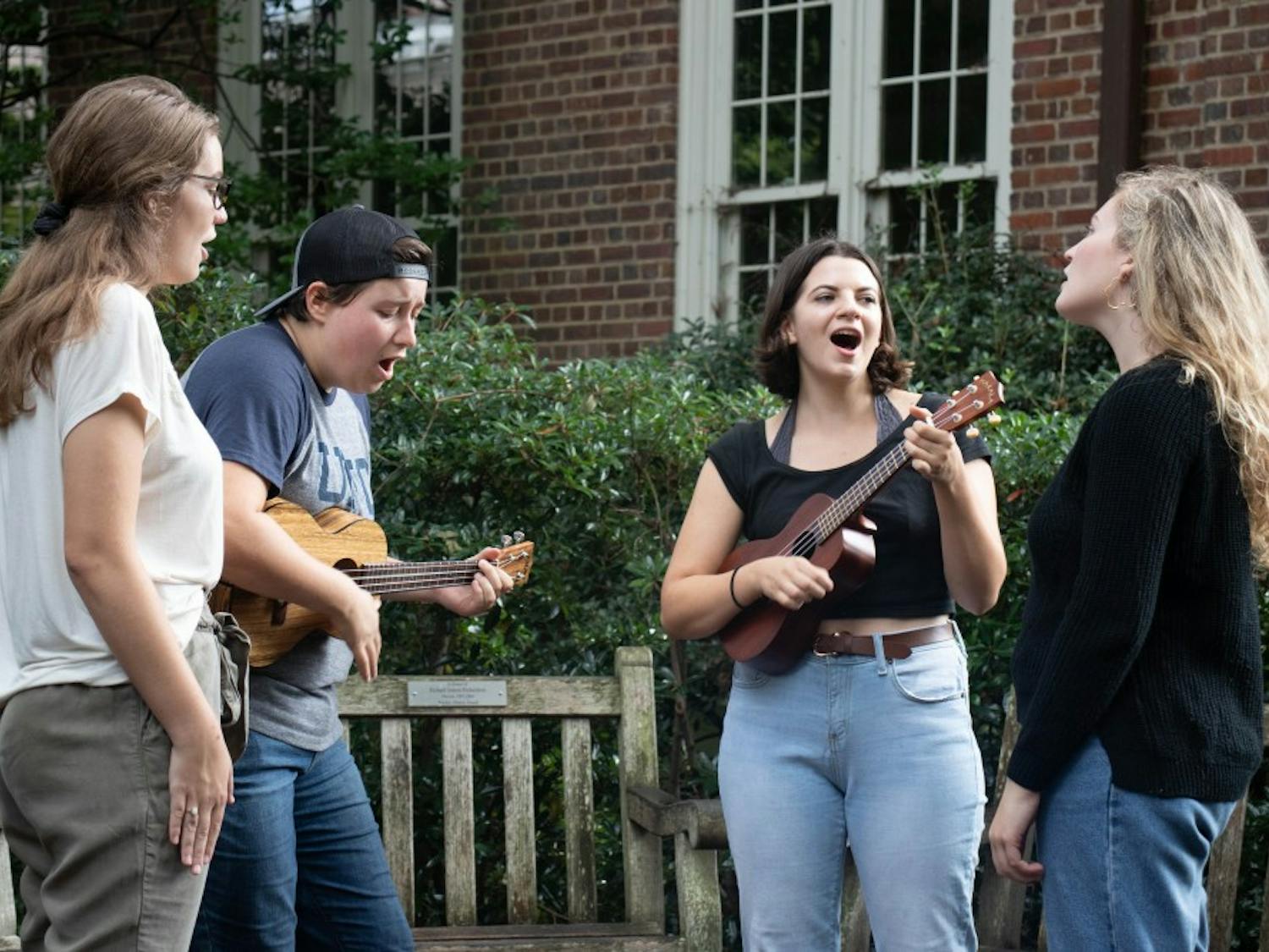 (From left to right) Hailey Haymond, Anna Sharpe, Kate Aberman and Caroline Porter, members of the Carolina Ukelele Ensemble, give an impromptu performance in Polk Place on Tuesday, Oct. 9, 2018.