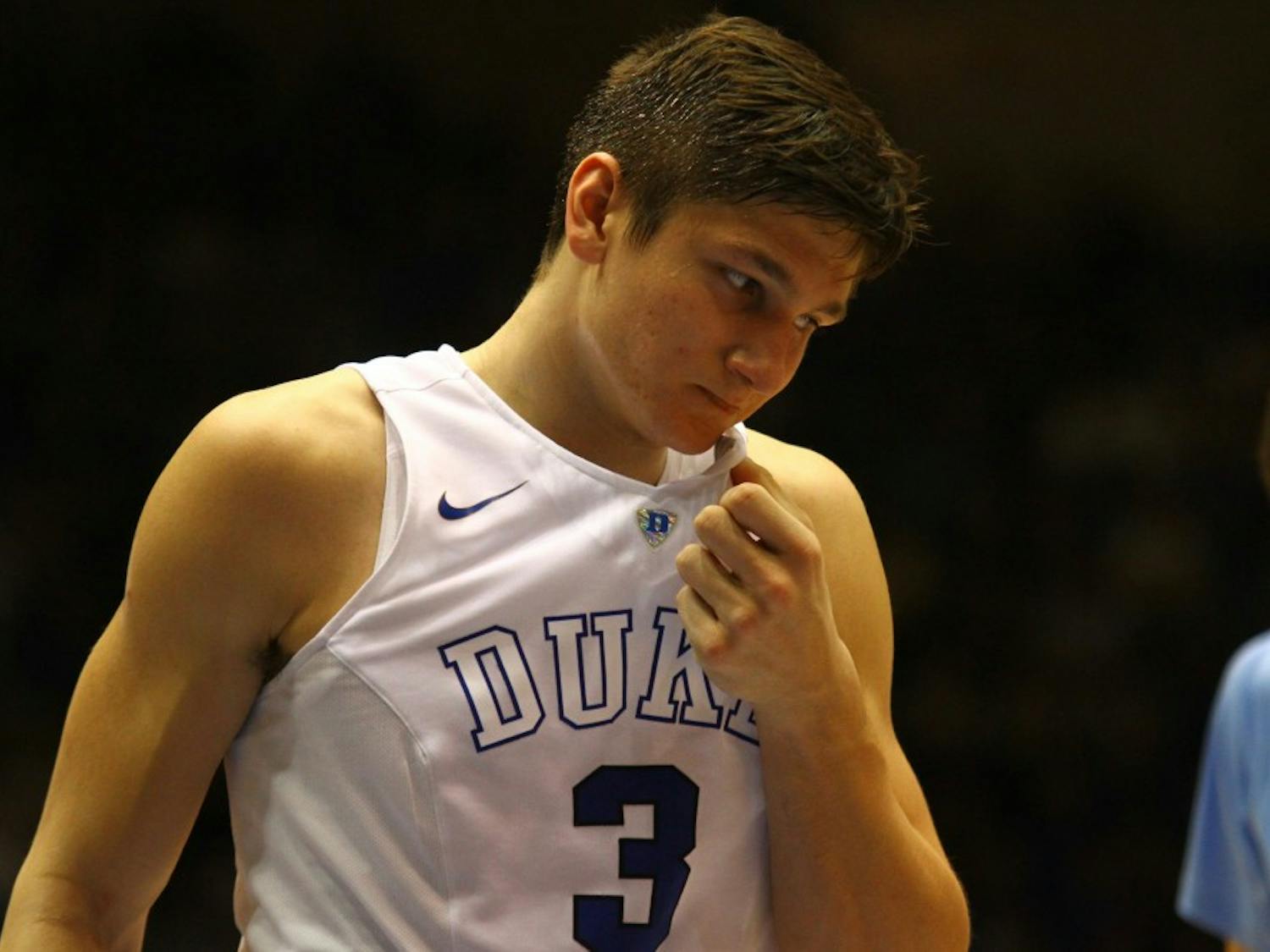Grayson Allen wipes his face with his jersey during North Carolina's 76-72 victory over Duke.