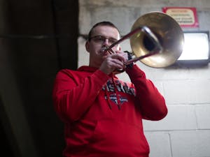 Christian Boletchek, a senior music major, practices his trombone in a parking deck on Rosemary St. on Saturday, Oct. 31, 2020.