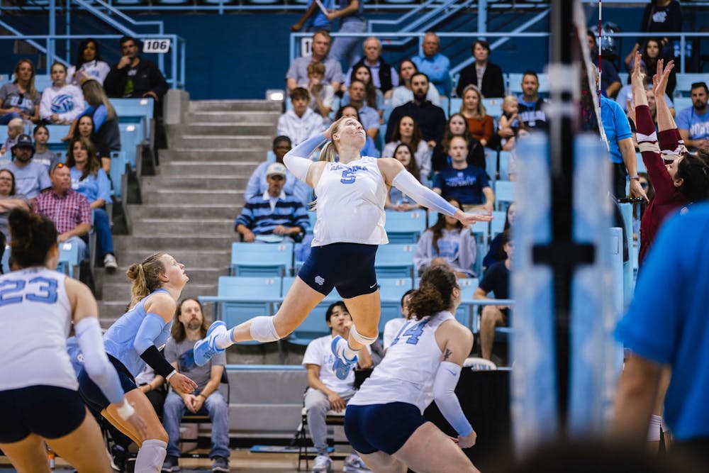 UNC graduate Charley Niego (5) spikes a ball early in the first set of the volleyball match against Boston College on Friday, Oct. 14, 2022. UNC beat Boston College 3-0.