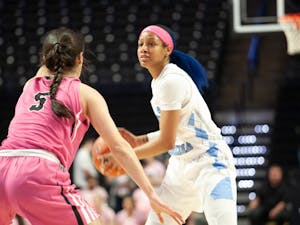 UNC red shirt senior guard Madinah Muhammad (3) keeps the ball from Wake Forest junior guard Gina Conti (5) at the Lawrence Joel Veterans Memorial Coliseum in Winston-Salem on Sunday, Feb. 23, 2020. The Tar Heels lost against the Demon Deacons 79-82.