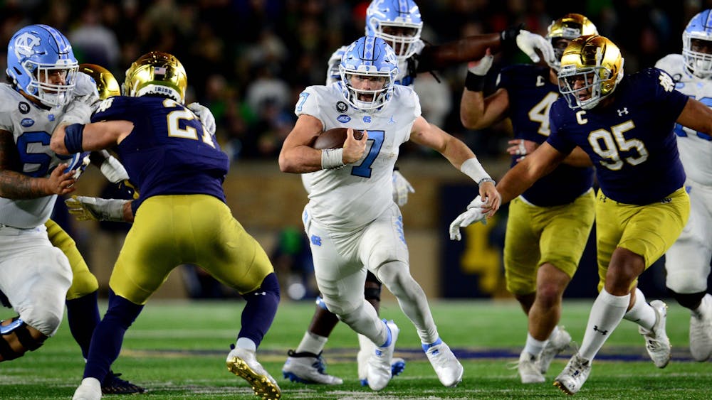 Junior quarterback Sam Howell runs with the ball during North Carolina's game against Notre Dame on Oct. 30 in South Bend, Ind. Photo courtesy of Jeff Camarati.