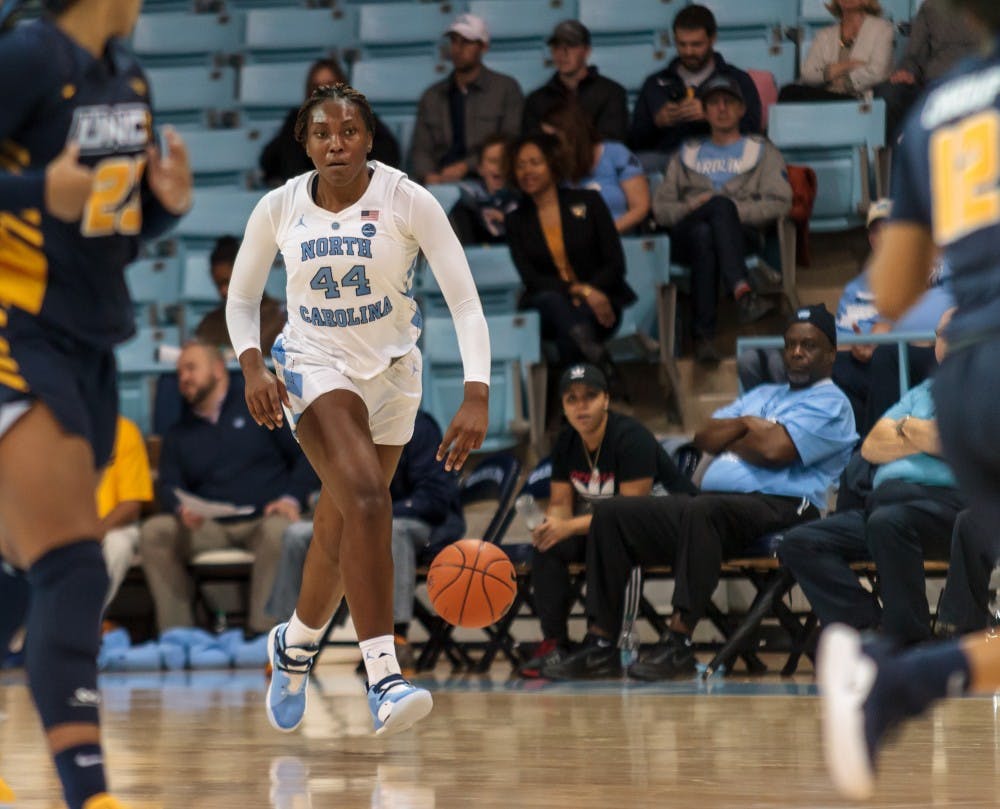 Center Janelle Bailey (UNC 44) dribbles the ball down the court during the UNC women's basketball home game vs. UNCG in Carmichael Arena on Friday, Dec. 14 2018.