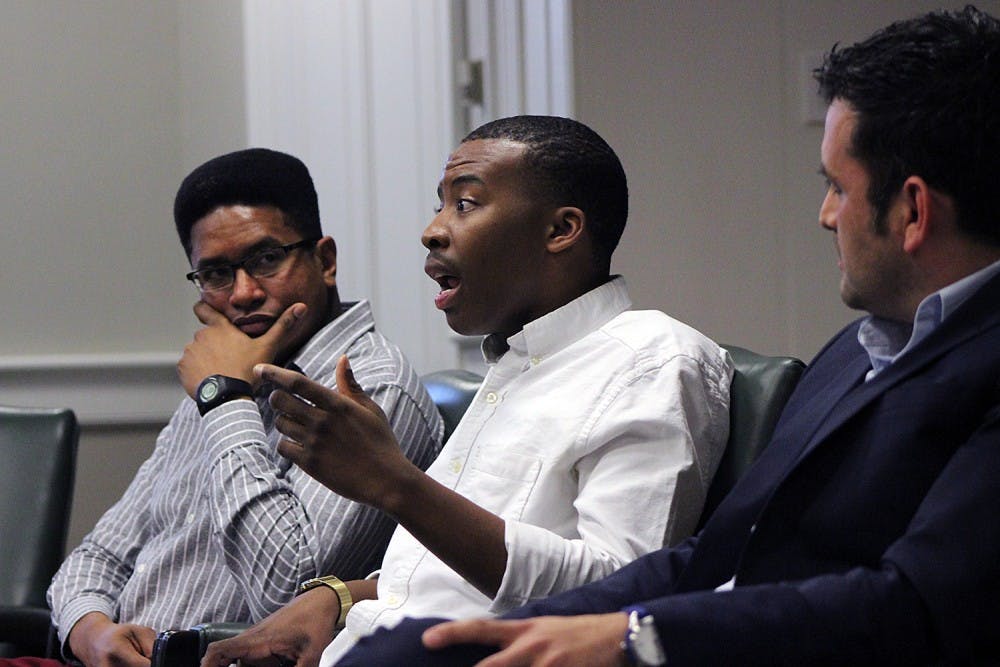 Osiris Rankin, a senior psychology major, Darius Whitney, a senior political science major, and Dr. Juan Carrillo, an assistant professor in the UNC School of Education, discuss their place in the university setting and the challenges they have faced as minority males at a Carolina Millennial Scholars Program's event entitled "The [Mis]sed Education of the Minority Male" Thursday evening in Wilson Library.