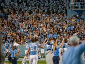 UNC fans celebrate a touchdown during the Tar Heels' home matchup in Kenan Memorial Stadium on Saturday, Sept. 11, 2021 against the Georgia State Panthers. The Tar Heels won 59-17.