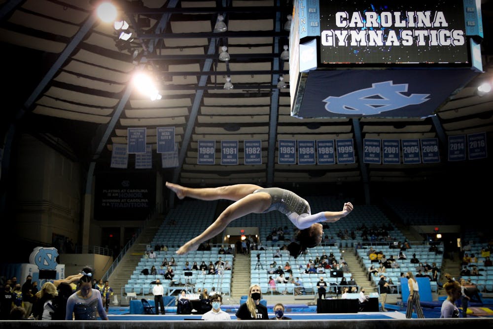Junior Hannah Nam warms up on beam during UNC gymnastics' home meet at Carmichael Arena on Friday, Jan. 28, 2022.